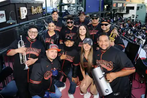 Laura Bravo with the full band in Gigantes jerseys on the stage at Oracle Park